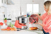The beautiful Coral Crush Ankarsrum brightens any kitchen. Shown here is the stainless steel bowl that can be purchased as an additional accessory if desired.
