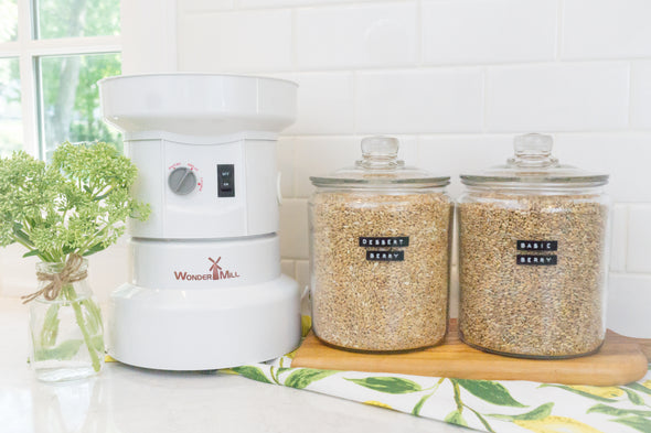 Unsifted's Starter Kit includes the WonderMill Electric (mill, flour canister assembly, and grey lid), Dessert Berry Blend, and Basic Berry Blend. (Note: The printed recipe cards, grey lid and flour cannister are not shown here)